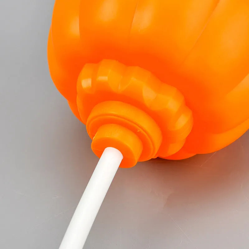 Plastic pumpkin decorative lamp with USB cable, available in purple or yellow light, measuring 22cm tall