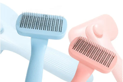 144g plastic pet needle comb for dogs and cats, shown in pink and blue colour options