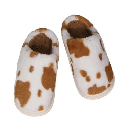 Cozy plush cow-print slippers with non-slip soles for comfortable indoor wear