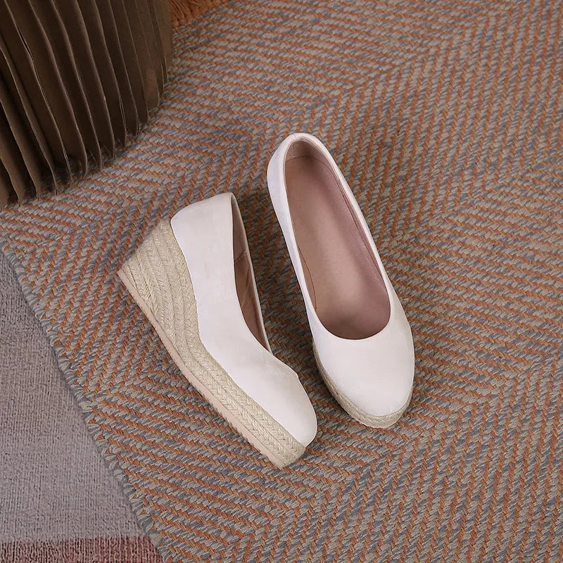 Women's wedge heel pumps with rope bottom detail in apricot colour with shallow mouth design