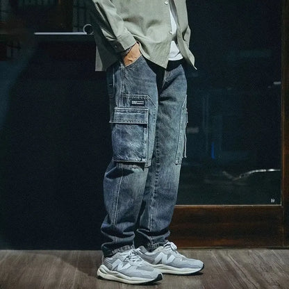Men's blue loose straight leg jeans with a zip fly, shown on a model.