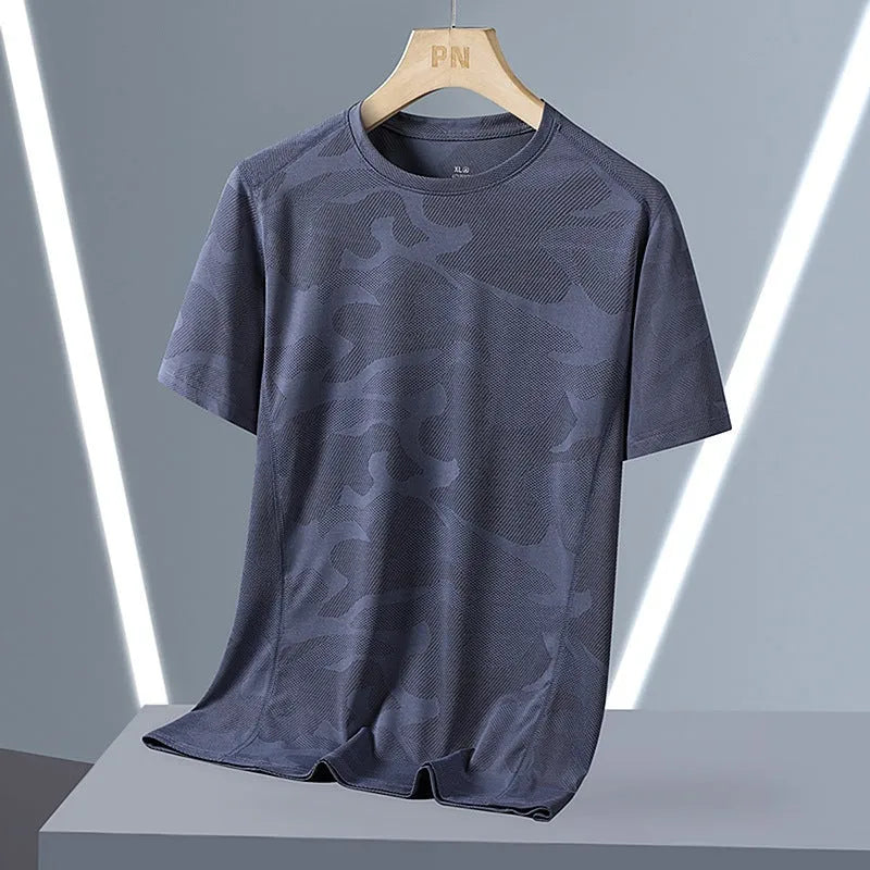 Men's loose fit camouflage nylon short sleeve summer top on a hanger