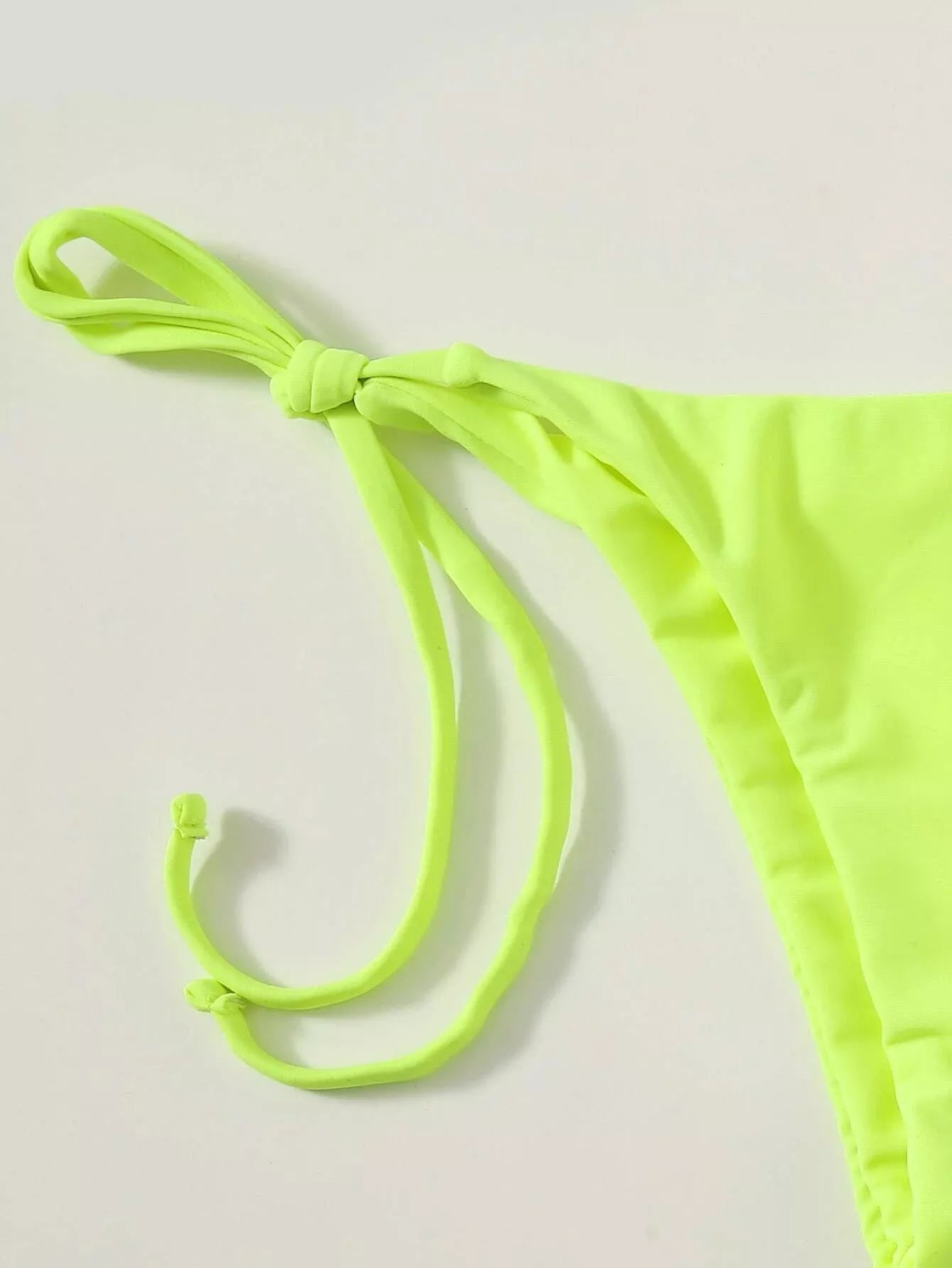 Women's three-piece mesh bikini swimsuit in vibrant colors, featuring a top, shorts, and skirt for versatile beachwear.