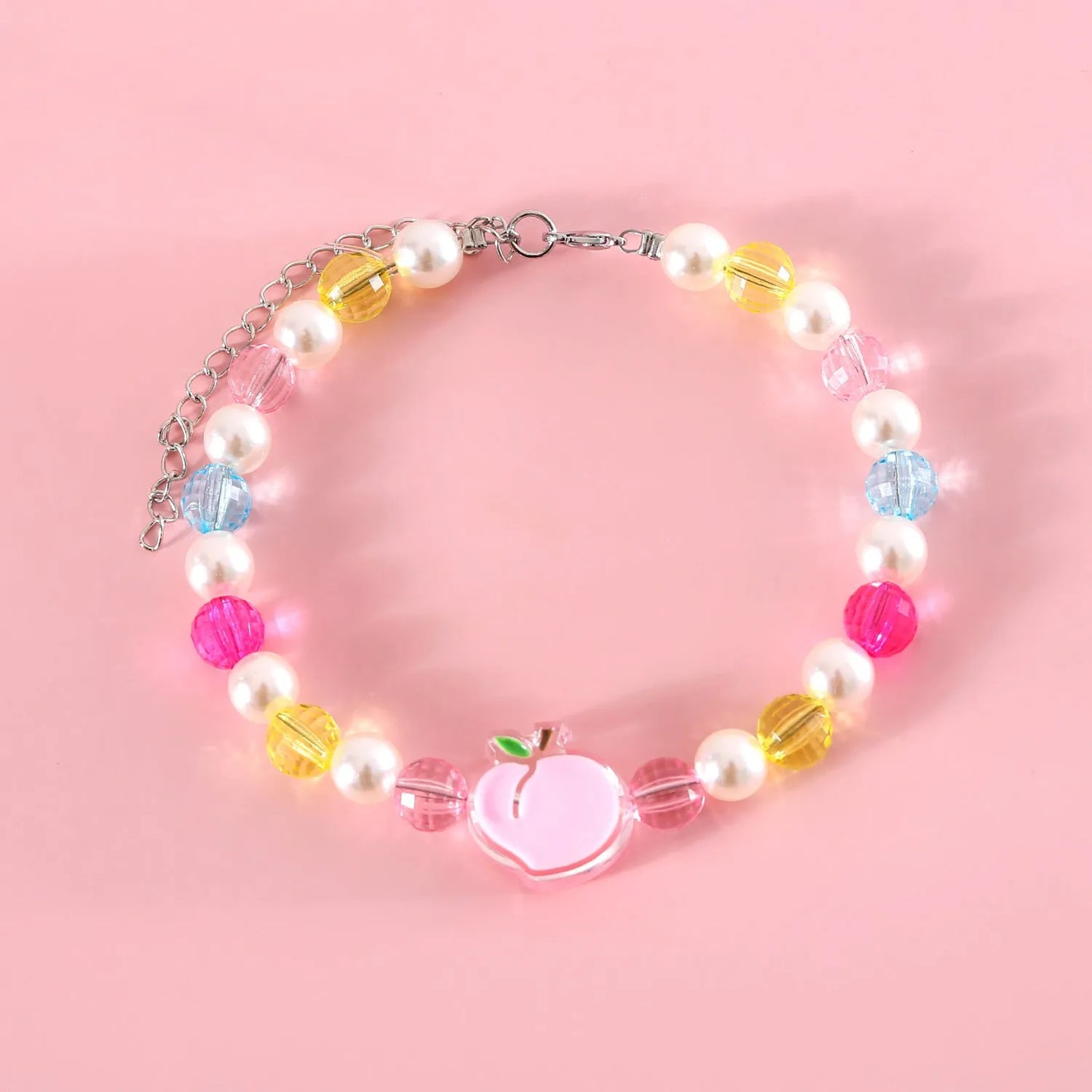 Colourful plastic bead cat necklace with adjustable clasp showing peach, rainbow, and small flower pattern options