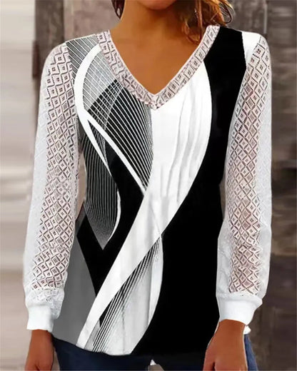 Purple V-neck loose top with hollow-out lace print and long sleeves.