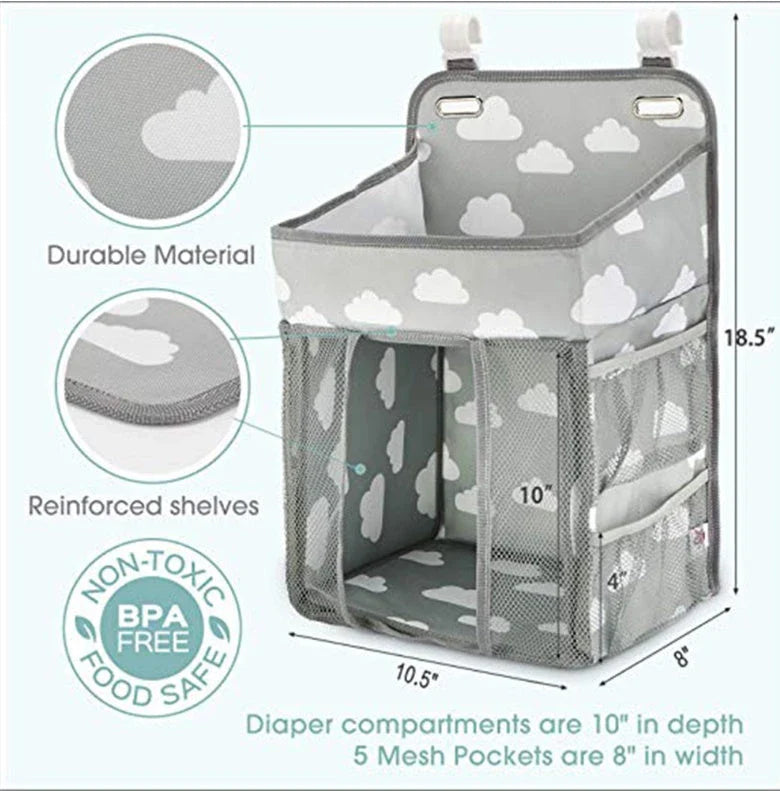 Portable baby crib organizer with hanging storage pockets for diapers, bottles, toys, and other nursery essentials