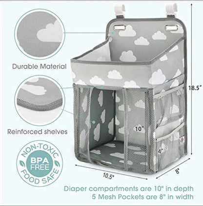 Portable baby crib organizer with hanging storage pockets for diapers, bottles, toys, and other nursery essentials
