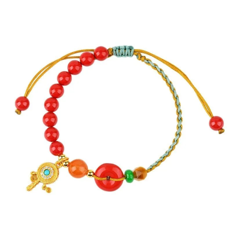 Hand-woven cinnabar peace blessing bracelet in emperor red sand with national style geometry design