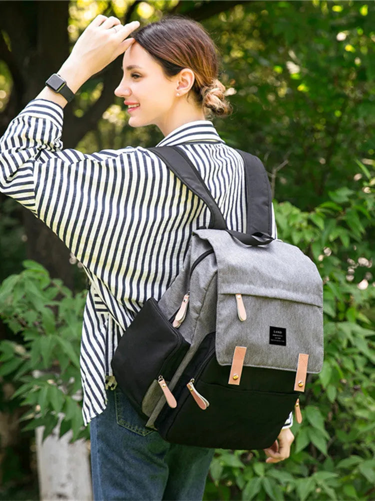 LAND Mommy large grey diaper backpack with changing mat, shown as a travel nappy bag.