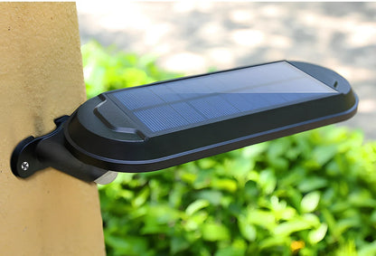 Solar wall light with black shell mounted on brick wall providing warm outdoor illumination