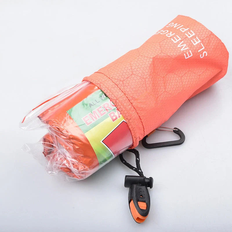 Orange First-aid Tent Insulation Mat reflecting sunlight, ready for emergency use