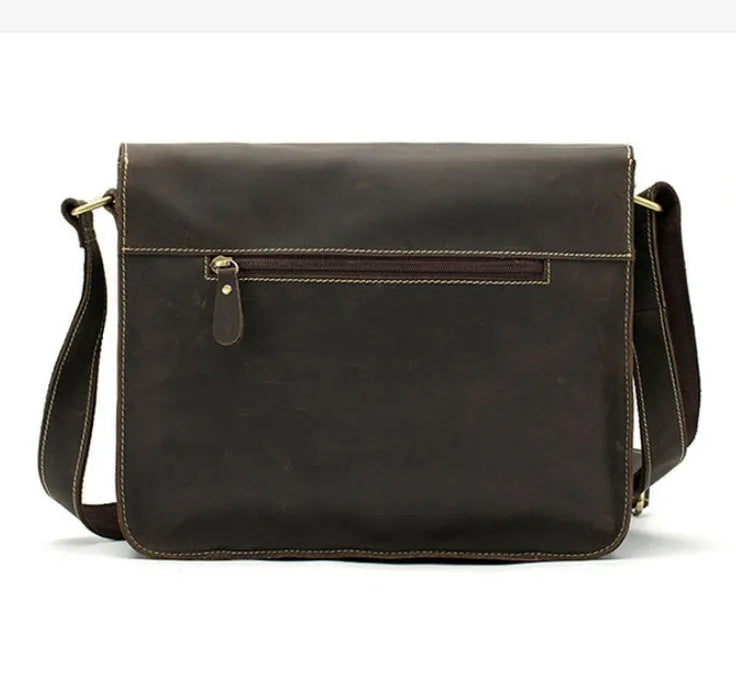 Leather vintage messenger bag in black with adjustable crossbody strap and brass buckle