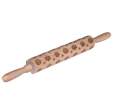 Wooden rolling pin with engraved Christmas patterns including reindeer and snowflakes on a 45cm long barrel.