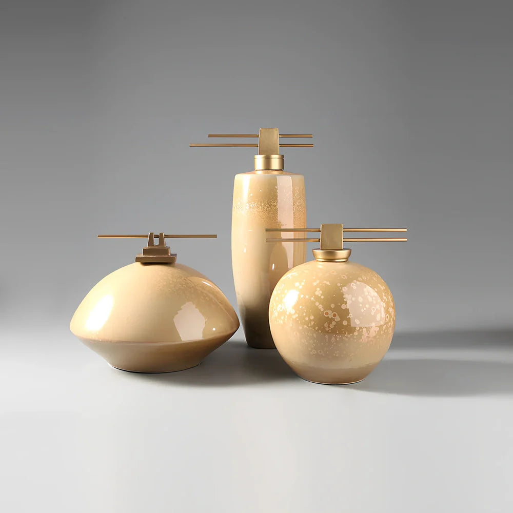 Handmade ceramic ornaments in graduated sizes with emerald green and golden sunlight glazes