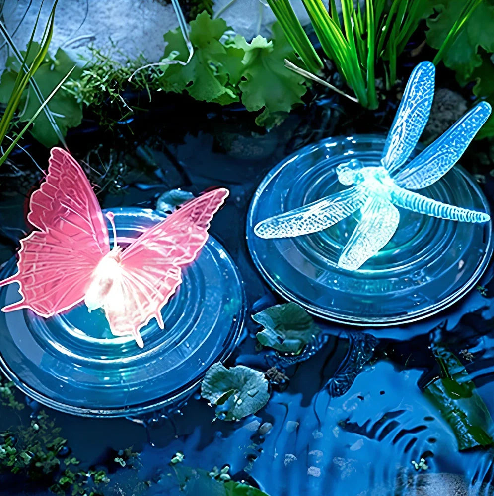 Solar LED float lamp with butterfly design floating on garden pond water surface