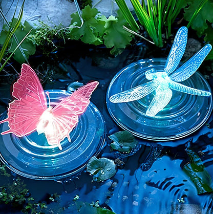 Solar LED float lamp with butterfly design floating on garden pond water surface