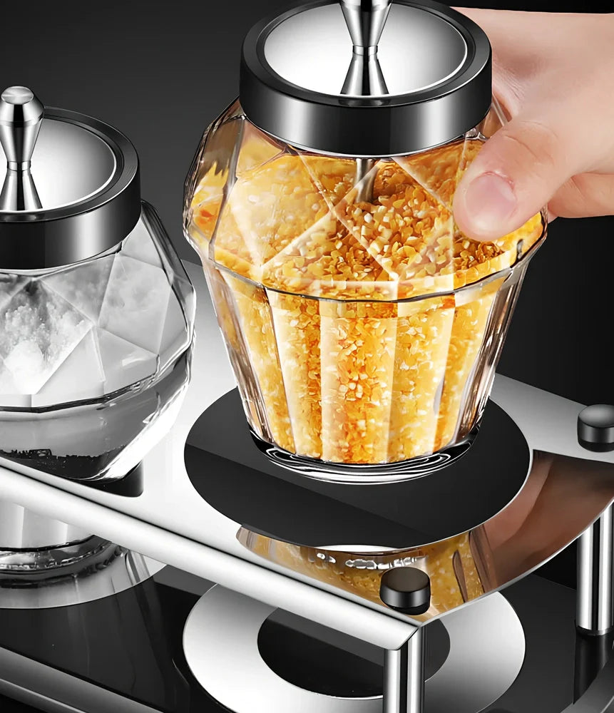 Glass seasoning jar with spoon cover for solid spices like salt and pepper on kitchen counter