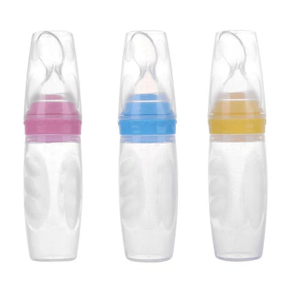 Blue silicone baby feeding spoon with squeeze mechanism, 19.5cm length