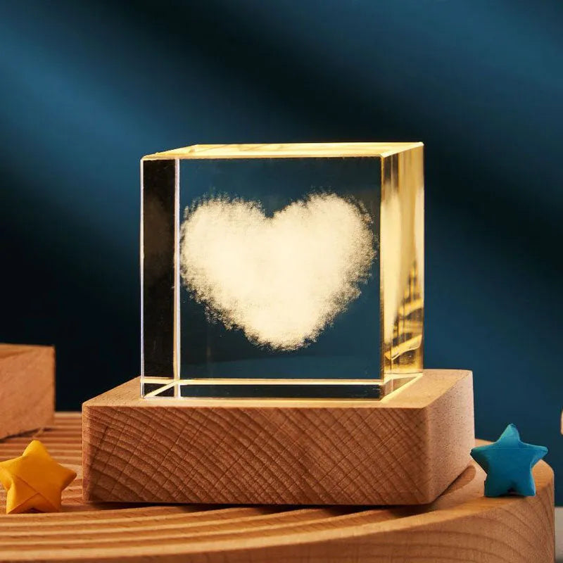 3D crystal cube night lamp showing transparent glass with internal engraving and warm light illumination