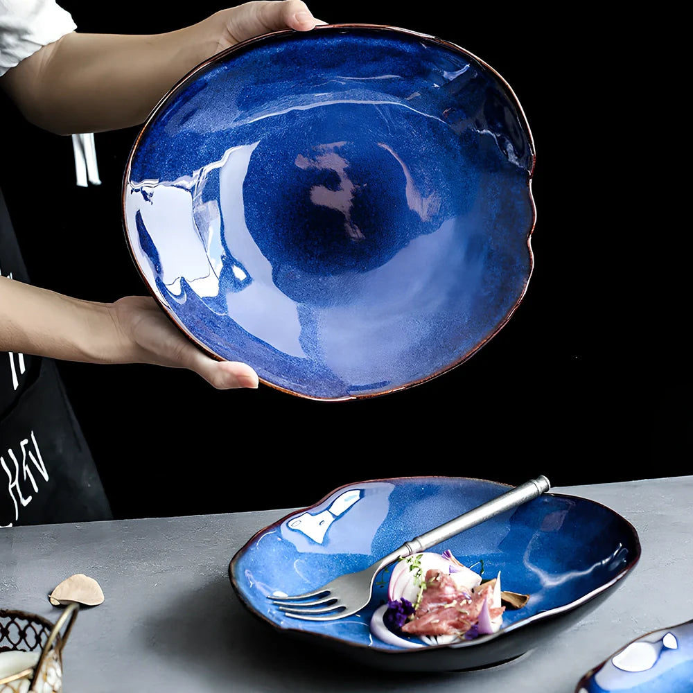 Blue irregular ceramic plate with kiln-changing glaze pattern, measuring approximately 20cm across irregular edges