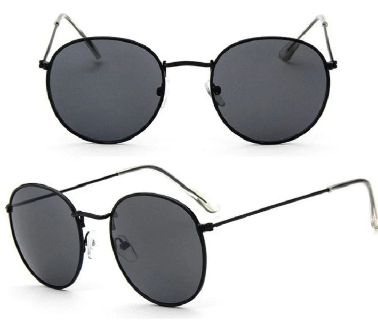 Stylish women's retro sunglasses with round frame and metal finish