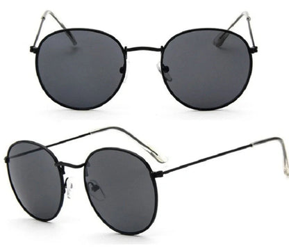 Stylish women's retro sunglasses with round frame and metal finish