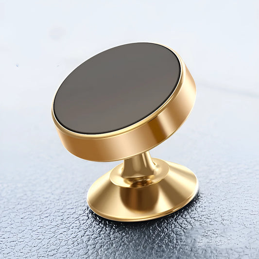 Black magnetic car phone holder with 360-degree ball joint mounted on a car air vent, holding a smartphone.