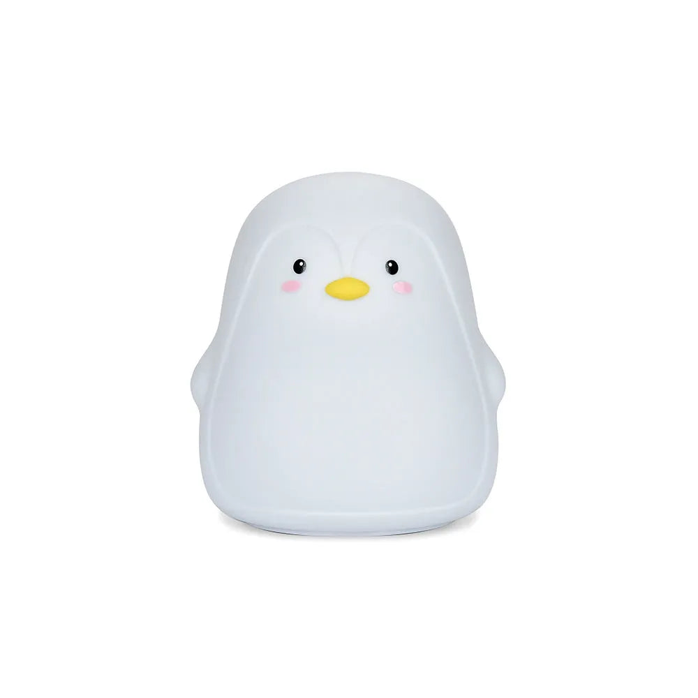 White silicone penguin-shaped USB rechargeable night light on a surface.