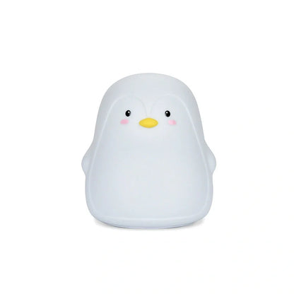 Penguin-shaped night light with soft white LED illumination and USB charging port