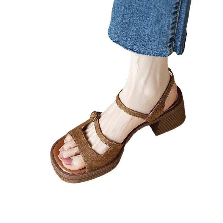Beige women's open-toe square toe platform sandals with a retro design on a white background.