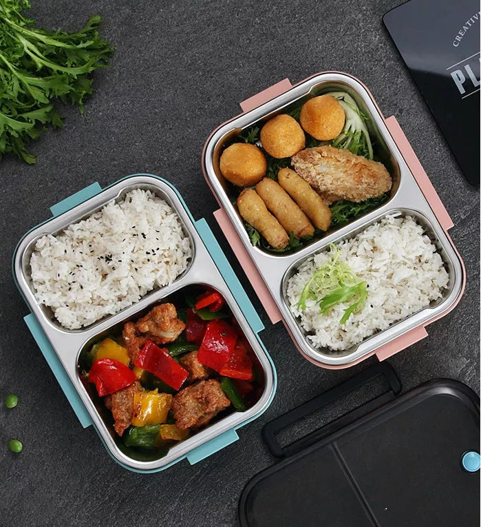Stainless steel insulated lunch box with food segmentation in pink, blue, and khaki