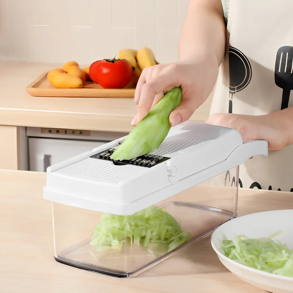 Multipurpose vegetable cutter with seven blades, drain basket and accessories on kitchen counter