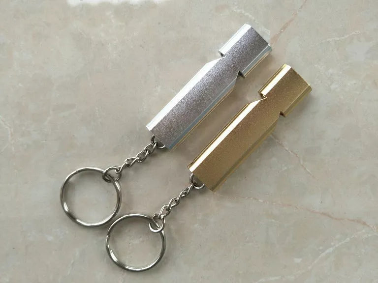 Outdoor survival whistle with keychain in gold and silver options