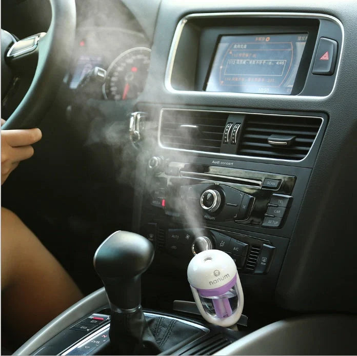 Compact car humidifier with 180-degree rotation for even air moisture, available in multiple colors
