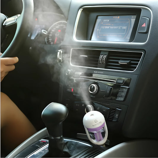 Portable car humidifier unit showing compact design with rotation capability for vehicle use