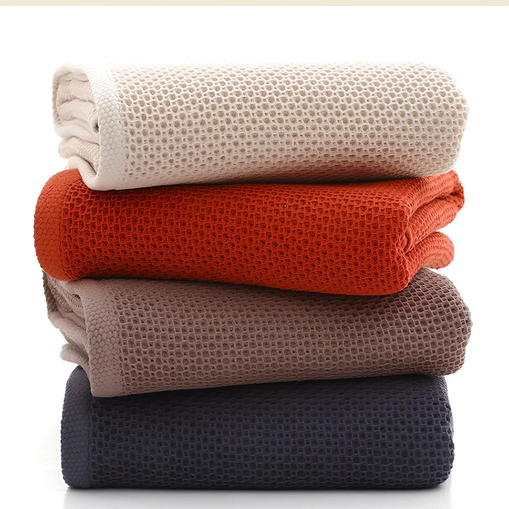 100% cotton honeycomb weave face towel in blue colour showing textured pattern and 70x140cm dimensions