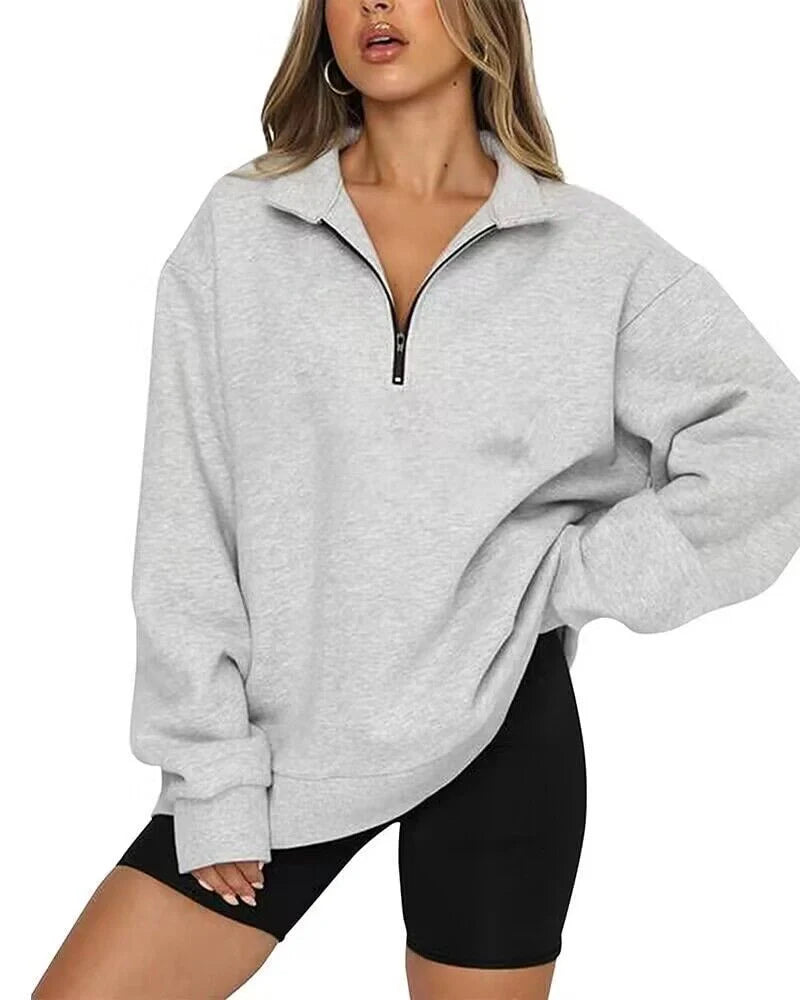 Women's zip turndown collar sweatshirt in various colors, showcasing loose fit and zipper detail.