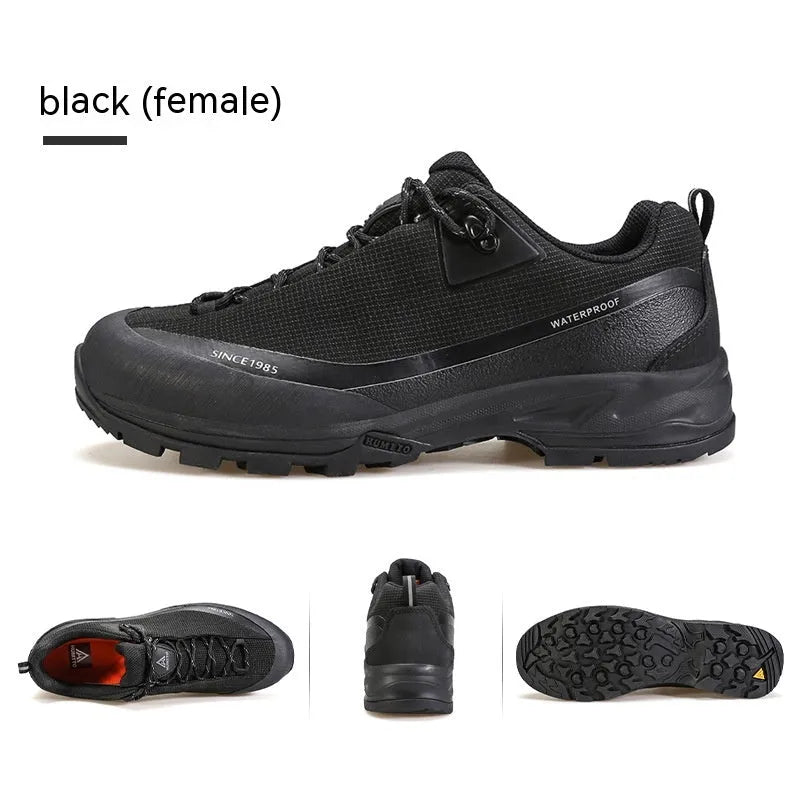 Men's low-top hiking boots in black with lace-up front and rubber outsole.