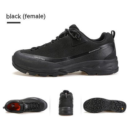 Men's low-top hiking boots in black with lace-up front and rubber outsole.