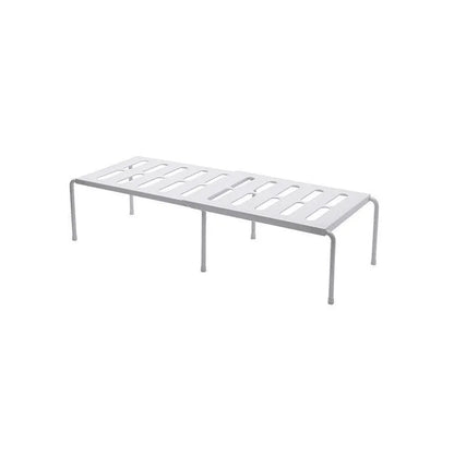 White telescopic kitchen storage rack at adjustable height on a countertop
