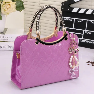 Lingge PU square shoulder bag for women with rhombic quilted design, zip opening, and hard handle.