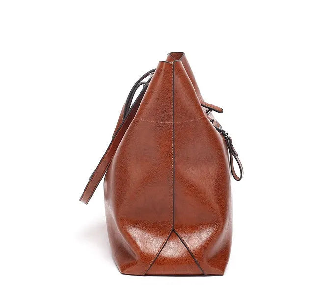 Leather cross-body handbag in Black colour with dimensions 30cm by 37cm by 13cm, showing internal pockets