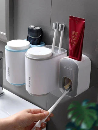 Wall-mounted automatic toothpaste dispenser with toothbrush holder and storage organizer, available in black and grey colors