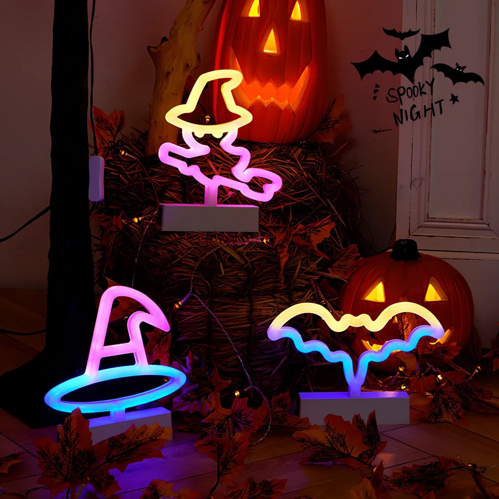 Set of nine glowing Halloween pumpkin lanterns in varying sizes from 14.5cm to 23cm height with plastic construction