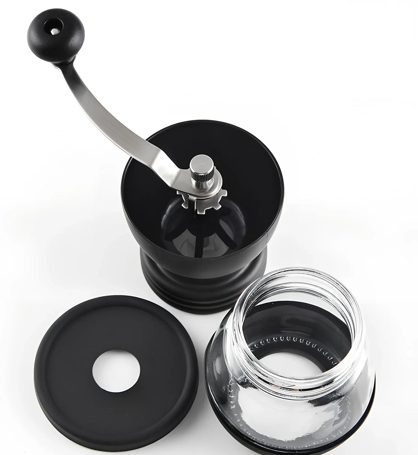 Manual coffee grinder with beech wood body and stainless steel grinding mechanism on kitchen counter
