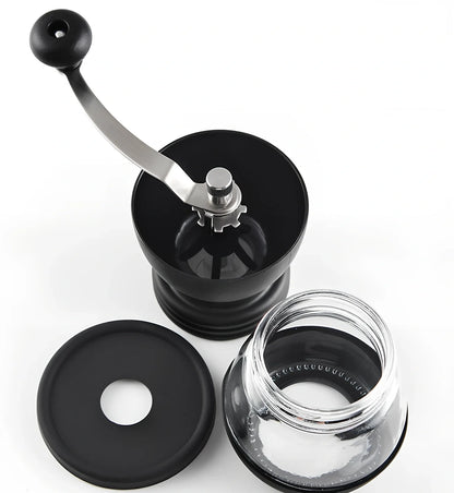 Manual coffee grinder with beech wood body and stainless steel grinding mechanism on kitchen counter