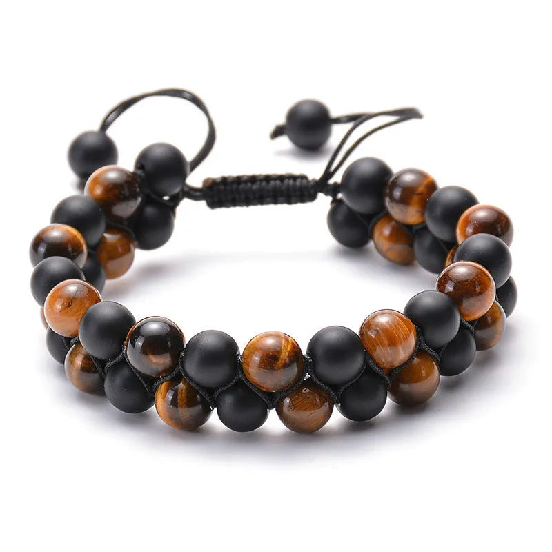 Tiger Eye and black agate geometric couple bracelets laid out as a matching set.