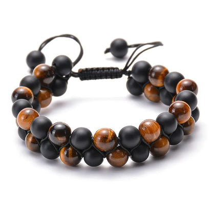 Tiger Eye and black agate geometric couple bracelets laid out as a matching set.