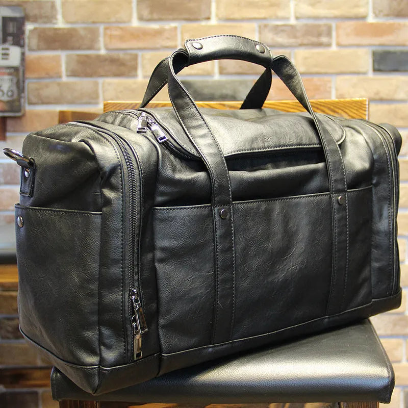 Black PU men's travel bag, 50cm wide and 26cm high, with phone, cigarette, and hidden zipper bags