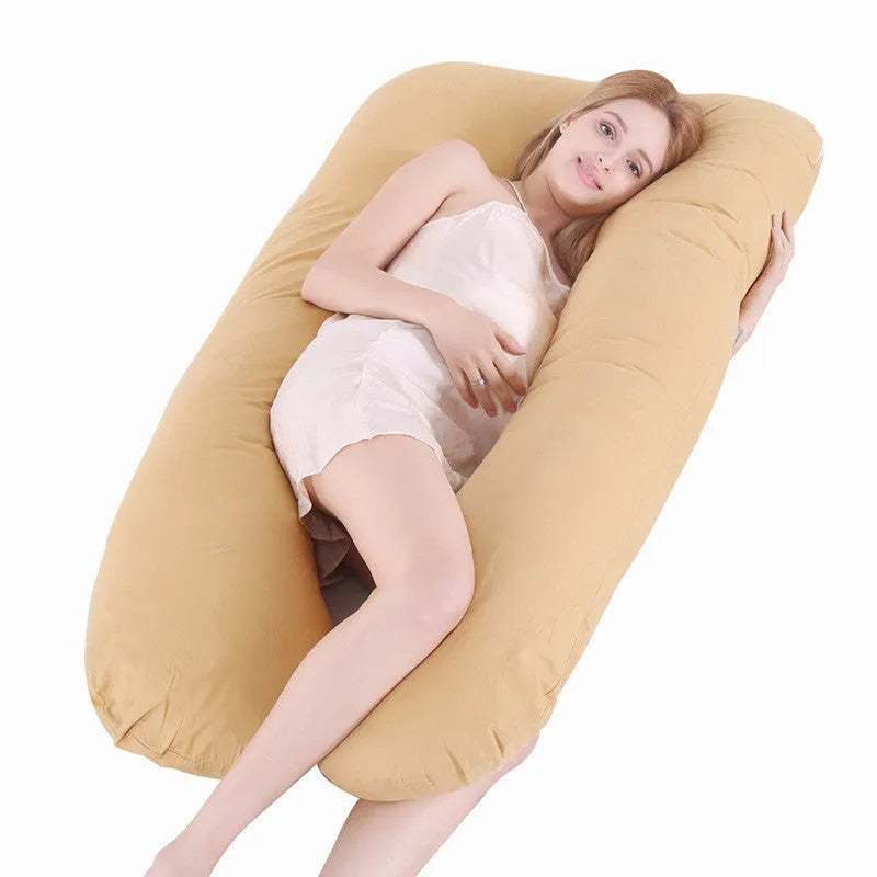 Large U-shaped pregnancy support pillow with removable cover and abdominal support belt.